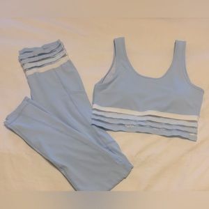 Never warn Baby blue and white yoga pants with pockets and matching sports bra